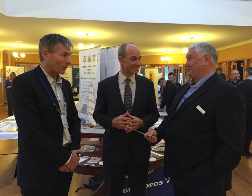 CONFERENCE: Tasmanian Mineral and Energy Council president Ray Mostogl and chief executive Wayne Bould talk business with Resources Minister Guy Barnett (centre) at last month's TMEC annual conference. Picture: Supplied