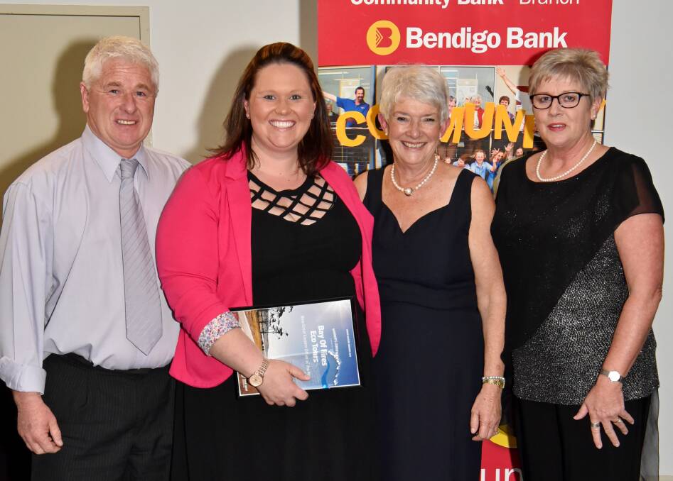 TRIUMPHANT: Bay of Fires Eco Tours' David Duggan and Alisha Roper collect an award for New Great Eastern Driver of the Year from Bendigo Bank's Jenny Logie and Lyn Mansfield.