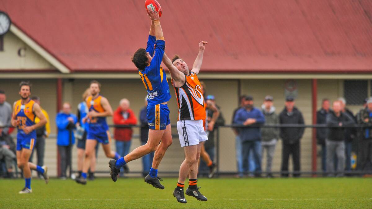 HANDS UP: Evandale's Anthony Axton marks strongly.