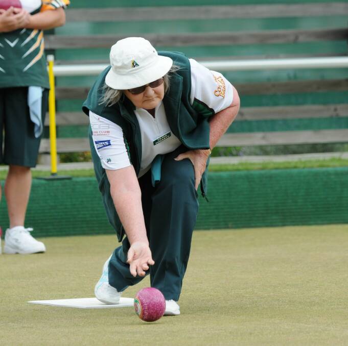 BOWLS NIGHT: Scottsdale Bowls Club's Vilma Fogarty sends one down the green. The club will host a Bowl For Your Balls event on June 22 to raise awareness for men's health.