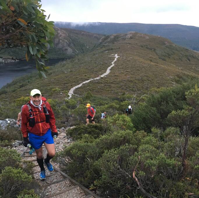 RUN WITH A VIEW: New South Wales athlete John Wood tackles an incline at Saturday's Cradle Mountain Run. Sixty runners including an athlete from Canada took part in the 80 kilometre event. Picture: Supplied