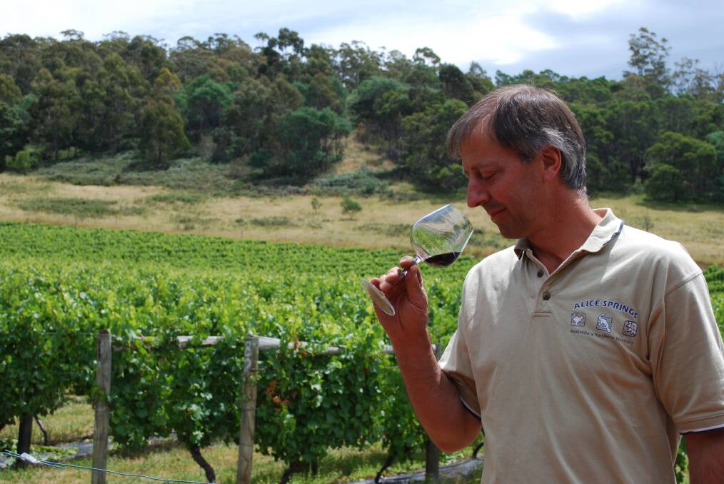COASTAL CHARM: Freycinet Vineyards' Claudio Radenti inspects a glass of red. The vineyard was one of nine to participate in last weekend's Great Eastern Wine Weekend. 