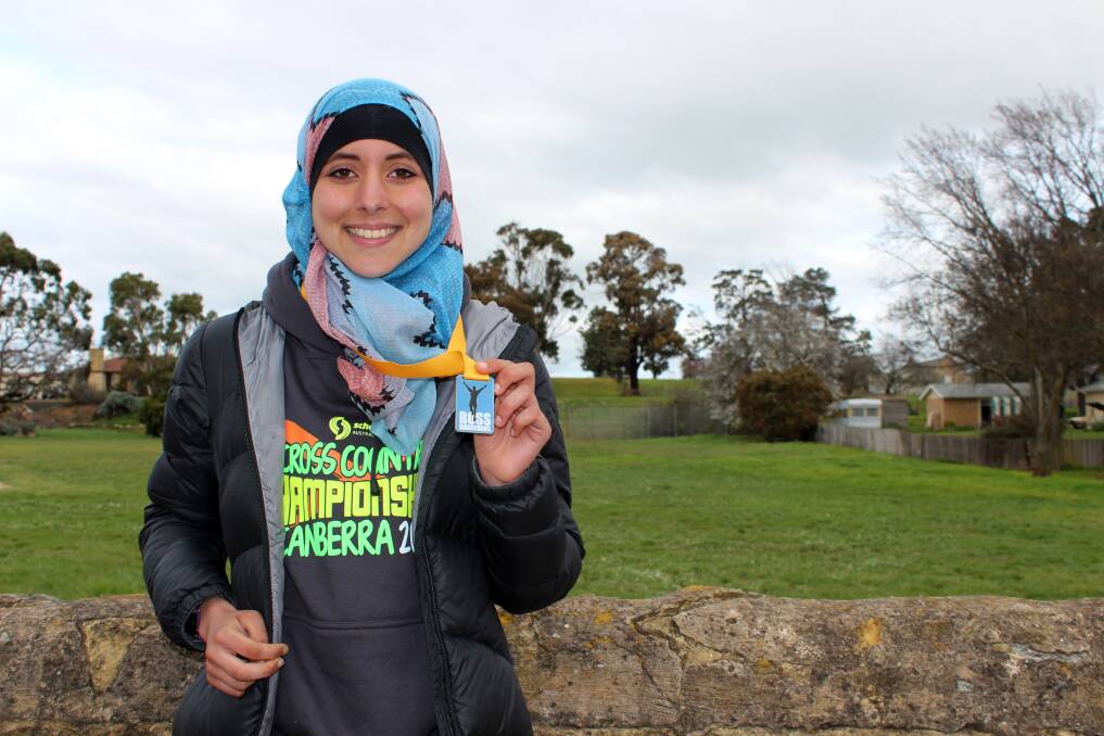EXTRA MOTIVATION: Hobart 17-year-old Meriem Daoui used the Ross Marathon to raise more than $3500 for a charity providing humanitarian relief in Syria. Picture: Hamish Geale 