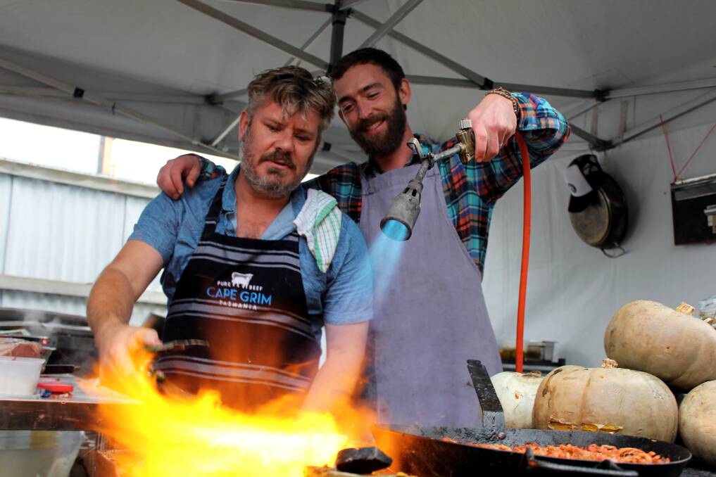 BRINGING THE HEAT: Quartermasters Arms' Stuart Addison and Tané Hunter prepare beef brisket at the Fresh Hop Beer Festival. Picture: Hamish Geale 