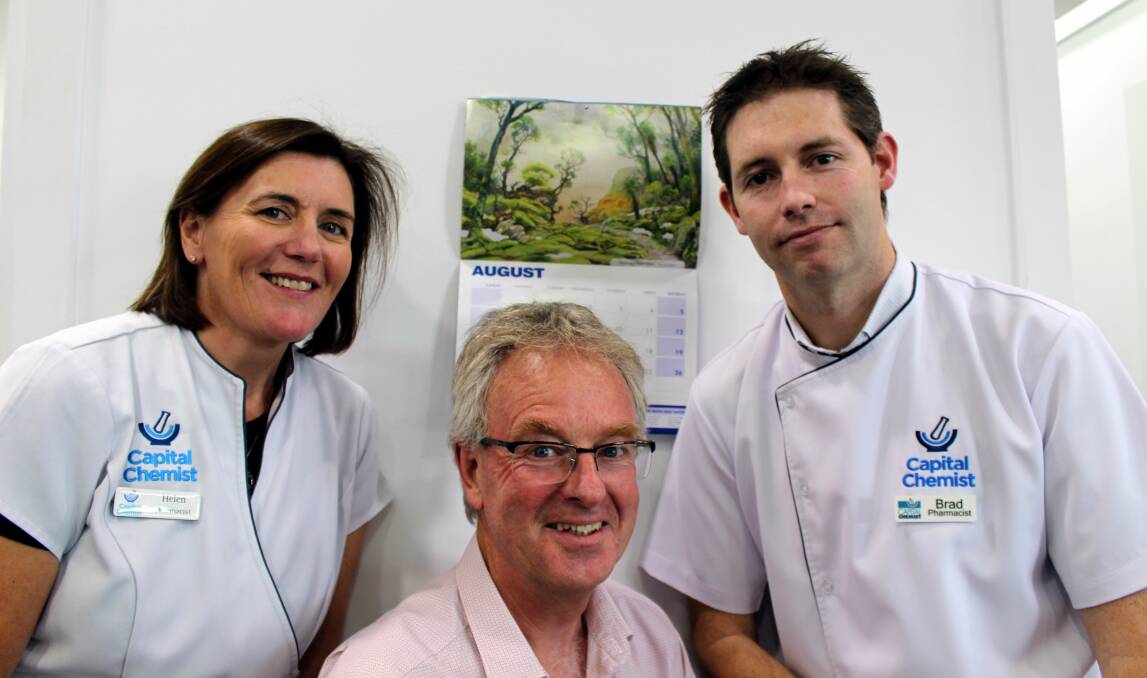WRIGHT ON TIME: St Giles chief executive Ian Wright is flanked by Capital Chemist's Helen O'Byrne and Brad Turner. The chemist's Tasmanian stores have donated $5000 to the Kids Can't Wait Appeal. Picture: Hamish Geale 