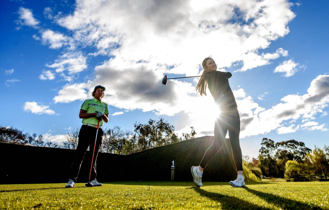 DRIVE: Prospect Vale Golfers Lily Caelli, 17, and Ryan Thomas, 16, are juggling study with the dreams of turning professional. Picture: Scott Gelston.