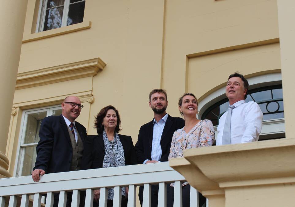 RAISING THE ROOF: Lyons Liberal MHR Eric Hutchinson, National Trust chair Dr Marion Myhill, Heritage Tasmania's Ian Boersma, National Trust board member Zoe Smith and National Trust managing director Matt Smithies celebrate the opening of Clarendon House's new roof.  