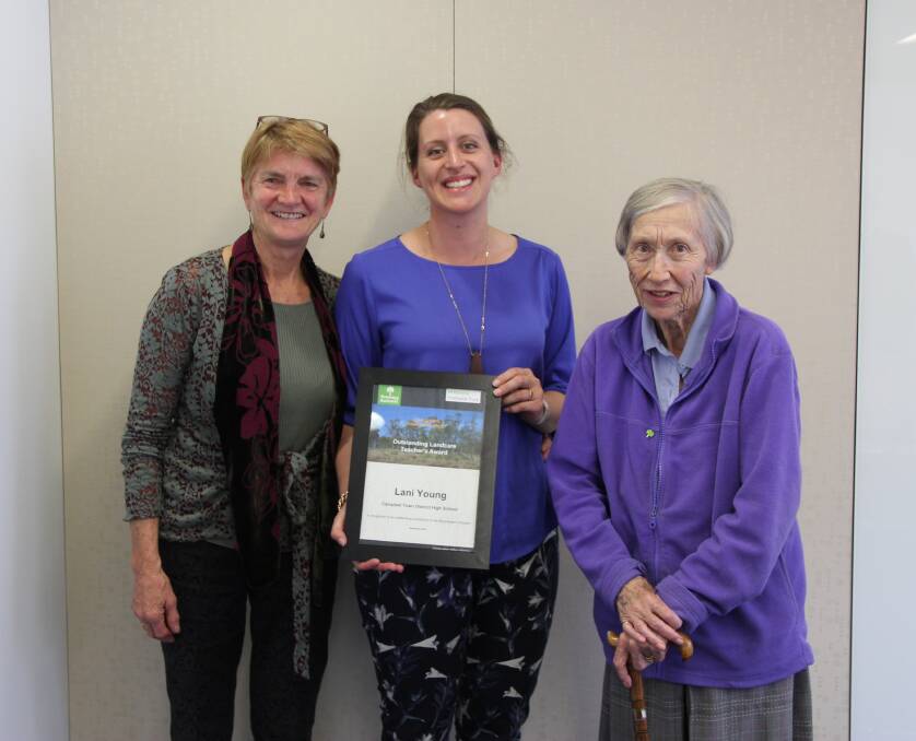 ALL SMILES: Greening Australia's Nel Smit and John Roberts Charitable Trust's Patricia Roberts present the Midlands Bushranger Teacher’s Award to Campbell Town District High School teacher Lani Young. Picture: Supplied 
