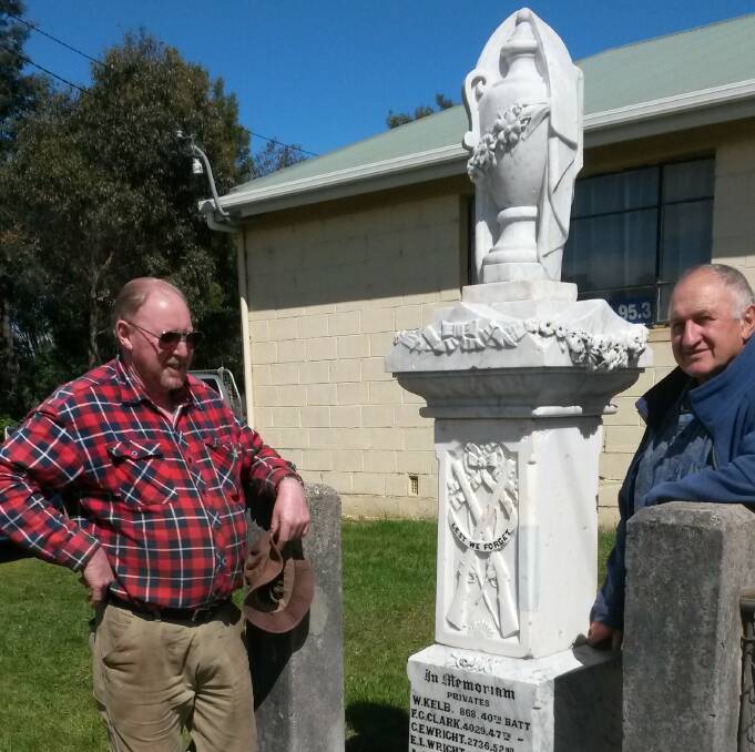 RESTORED: Sidmouth Hall Committee member Michael Lees and stone mason Henry Kulinski at the recently restored Sidmouth War Memorial. Picture: Supplied