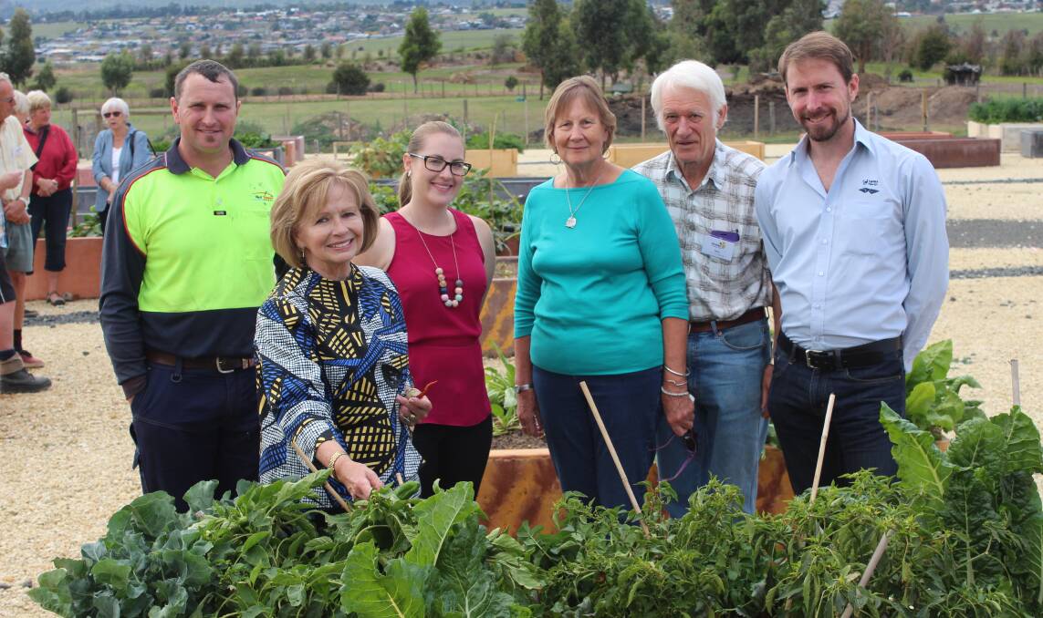 GREEN THUMBS: West Tamar Council's Ashley Batty, Christina Holmdahl and Kaitlin Roach check out the new garden beds with community gardeners Faye Cook, Terry Cook, and NRM North's Adrian James. Pictures: Hamish Geale 