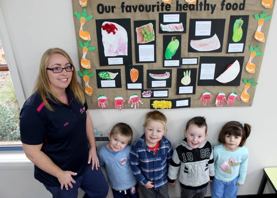 HEALTHY HABITS: Toddle Inn Child Care Centre director Julie Purdon with Archie Ainslie, 3, Walter Barwick, 4, Connor Lord, 4, and Tamsyn Harris, 4. The Deloraine centre has recently taken out two health awards. Picture: Hamish Geale