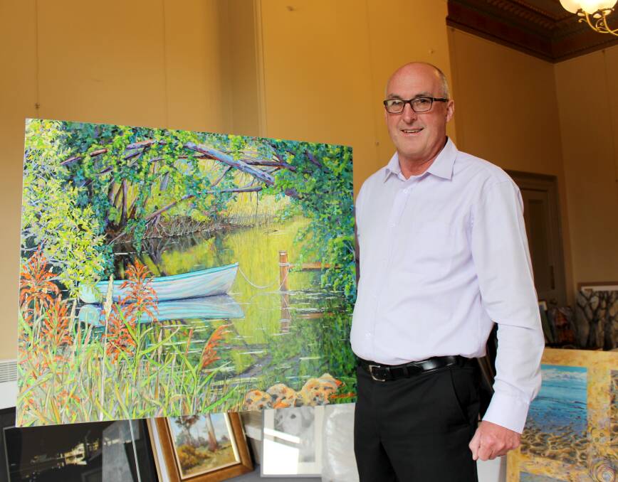 NEW FORMAT: Eskleigh Foundation chief executive Dale Luttrell examines a submission ahead of the Tasmanian Art Award. This year's exhibition will be on display between November 5 and November 7. Picture: Hamish Geale 