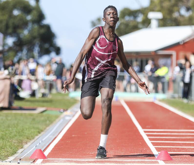 STRIDES: Launceston Christian School's Abayi Luate pushes off in the long jump.