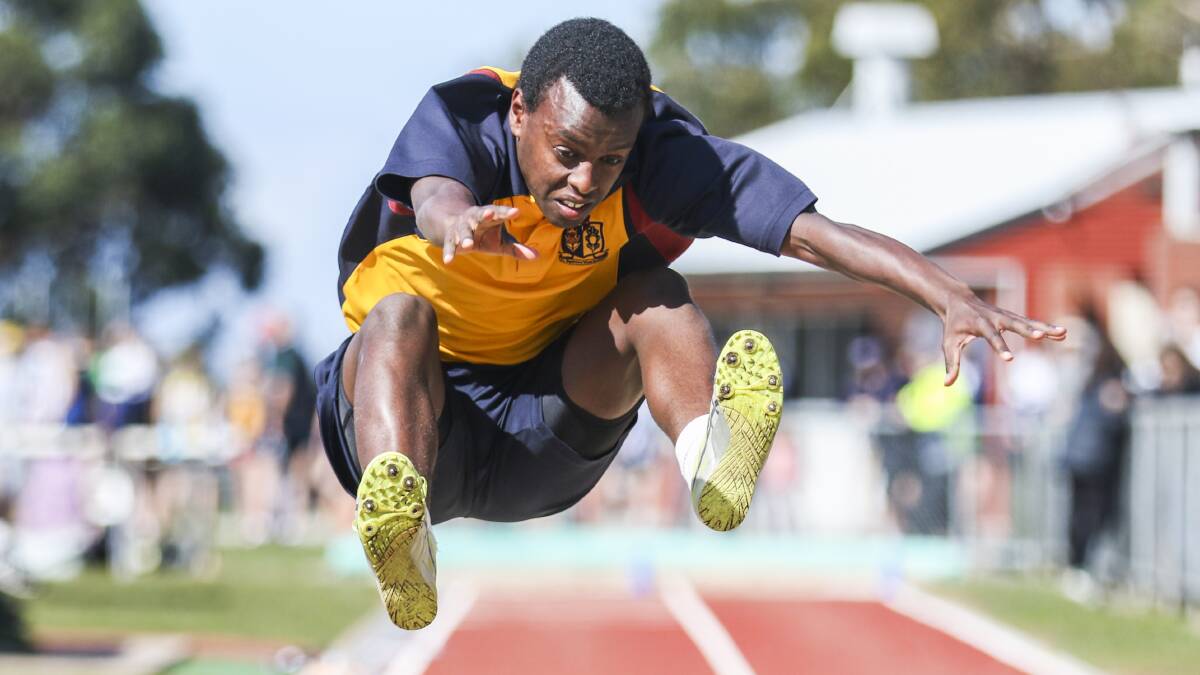 STRONG: Scotch Oakburn's Tamru Midson makes a strong leap in the long jump on Tuesday. 