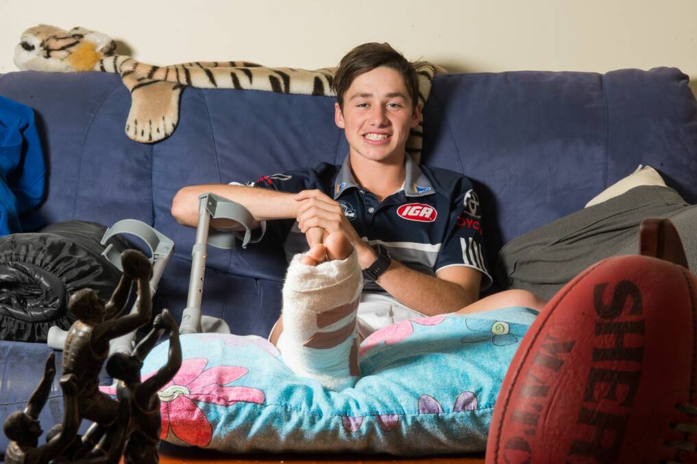 ALL SMILES: Talented Launceston footballer Chayce Jones is resting at his Longford home following ankle surgery in Hobart on Sunday. Picture: Phillip Biggs