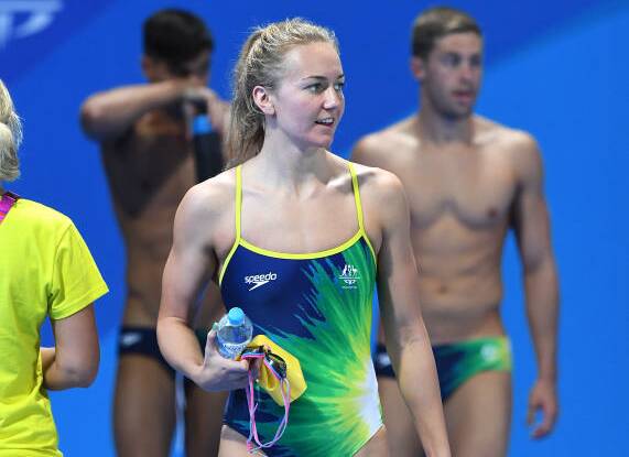 FIRST UP: Launceston swimmer Ariarne Titmus looks on during the Dolphins' training session at the Gold Coast Aquatic Centre. Picture: AAP