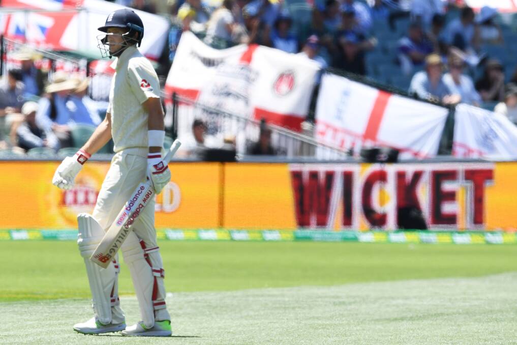 LONG WALK: England captain Joe Root after being caught behind by Australia's Tim Paine off Josh Hazlewood for 67 on Day 5 in Adelaide. Picture: AAP