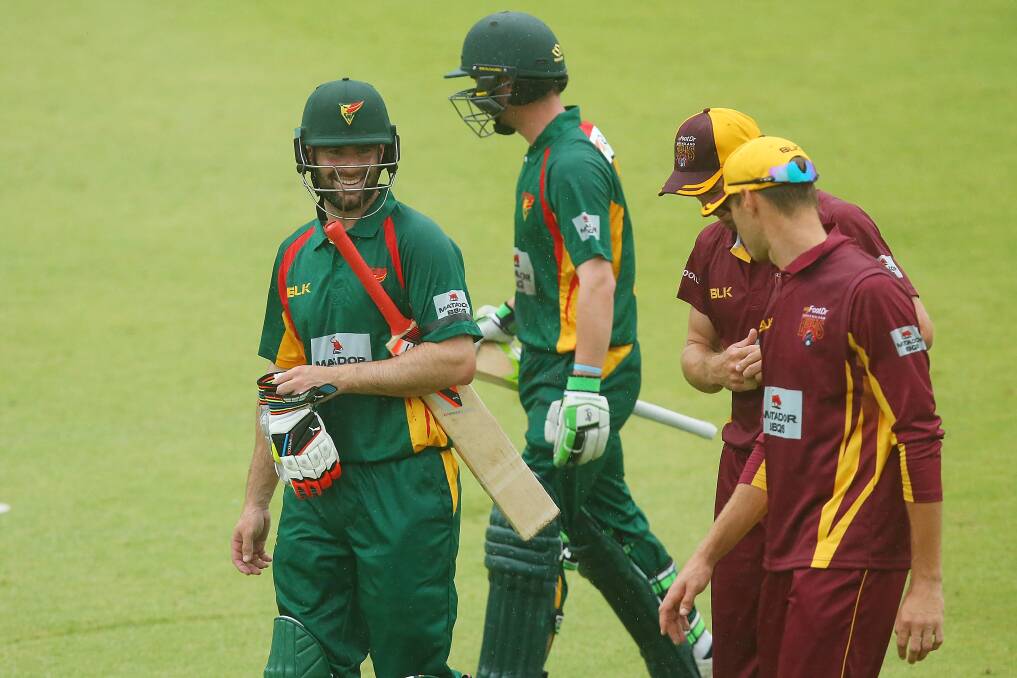 Tigers batsman Jake Doran and Alex Doolan leave the field during their Matador Cup match against Queensland Bulls at Allan Border Field. Picture: Getty Images
