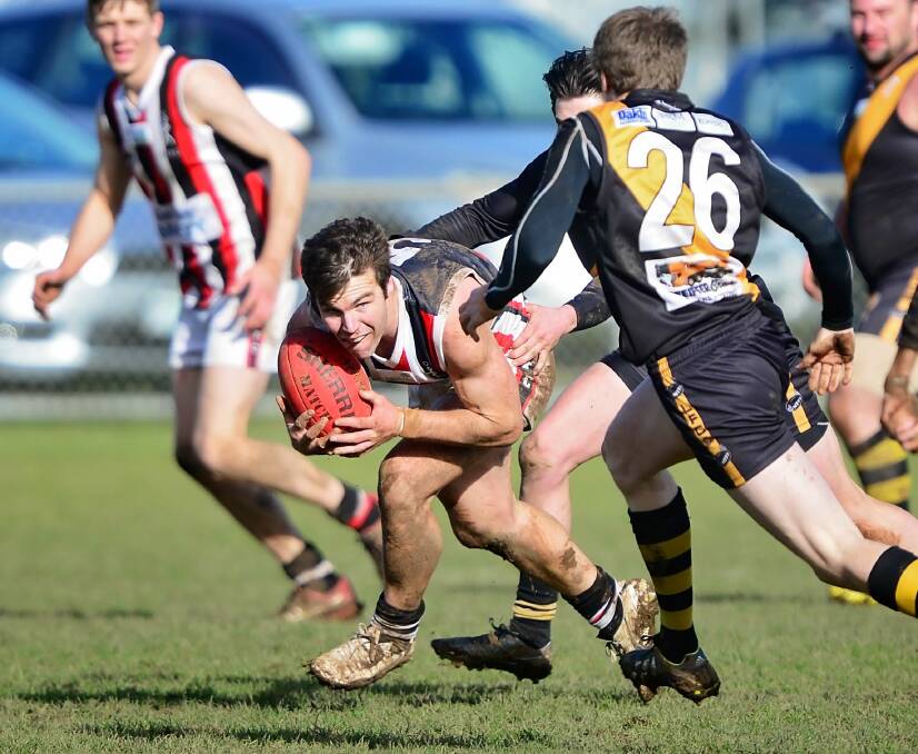 GUN: George Town playing coach Allan O'Sign in action against Longford at Tigerland last season. Picture: Phillip Biggs