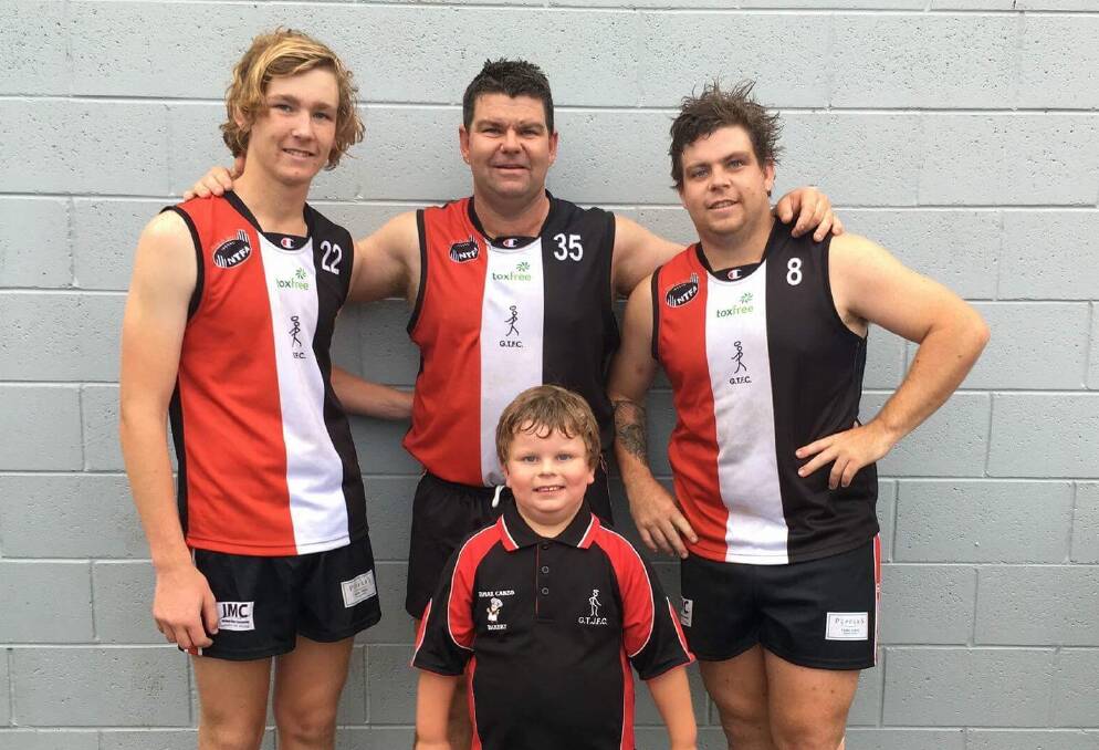 FAMILY AFFAIR: Retiring George Town great Myles Baker (centre) with his sons Dylan, Caleb and Shane before they played together earlier this season. Picture: Supplied