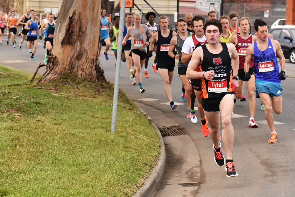 ON THE MARCH: Northern Tasmanian runner Jordan Tyler leads a big Launceston Ten pack out of William Street back in 2015.