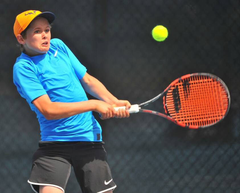 WATCHFUL: Casey Ambler competes in the 15 and under boys Junior Development Series semi-final at Launceston Regional Tennis Centre on the weekend. Pictures: Scott Gelston