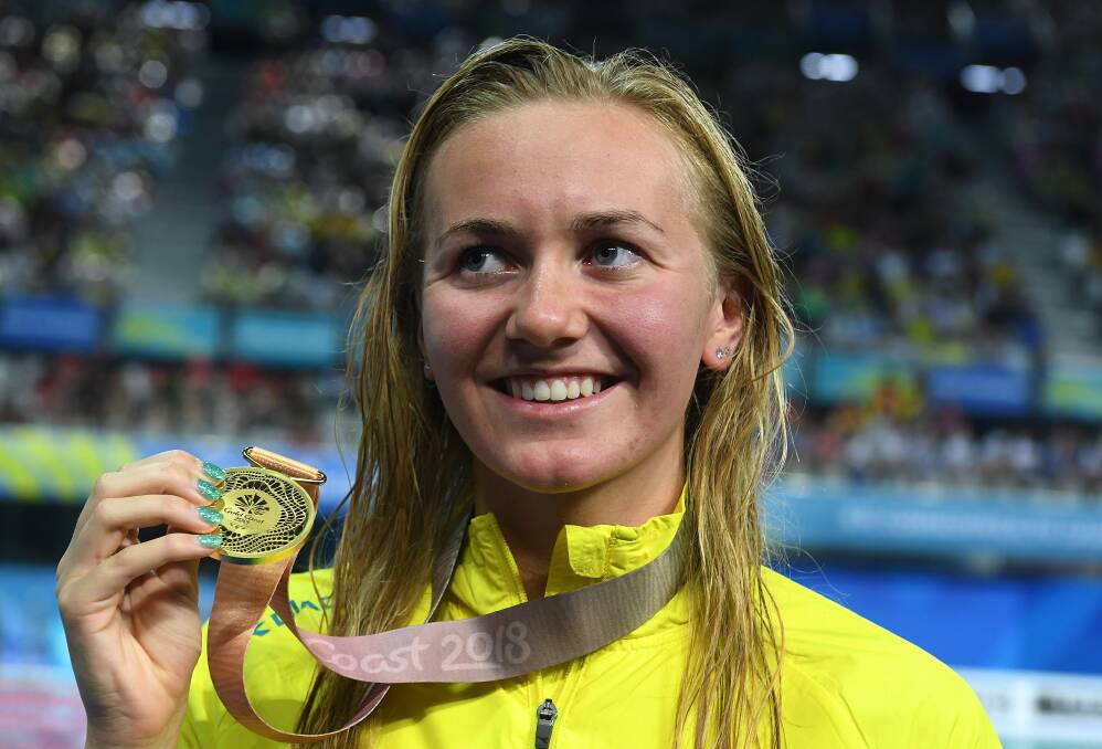 ALL SMILES: Ariarne Titmus after winning the women's 400m freestyle final at Gold Coast Aquatic Centre.. It is her third gold medal of the Commonwealth Games. Picture: AAP 