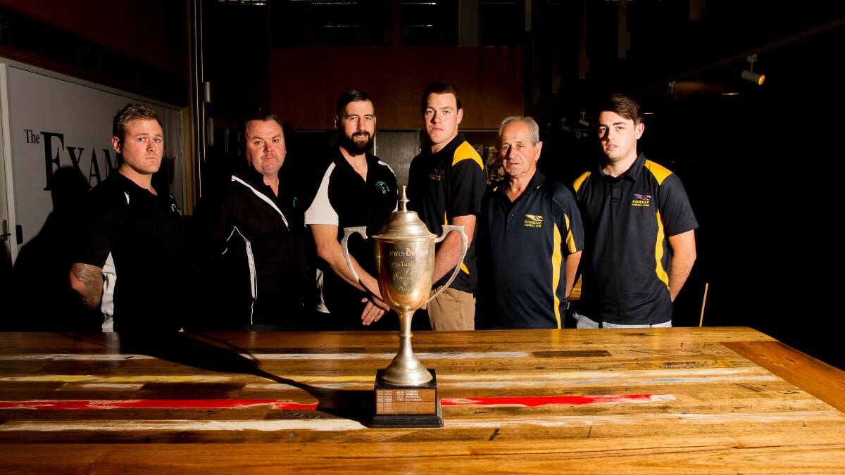 PRIZED POSSESSION: Perth's Jarrod Walker, Scott Bellinger and Damian Rhind eye off the Lewis-Button Cup with Evandale's Tyler Brown and Kevin and Kaden Lewis leading into this weekend's encounter. Picture: Scott Gelston