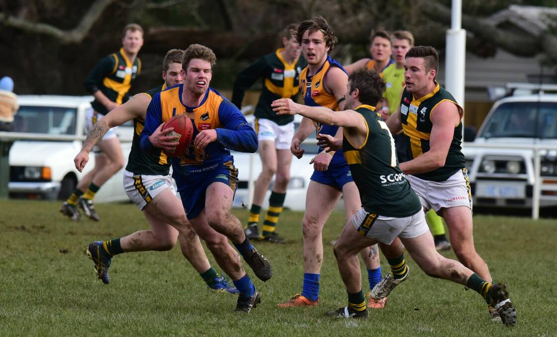 LOOKOUT: St Pats midfielder Brad Pearton closes in on Evandale's James Conroy at Morven Park on Saturday. Picture: Paul Scambler.