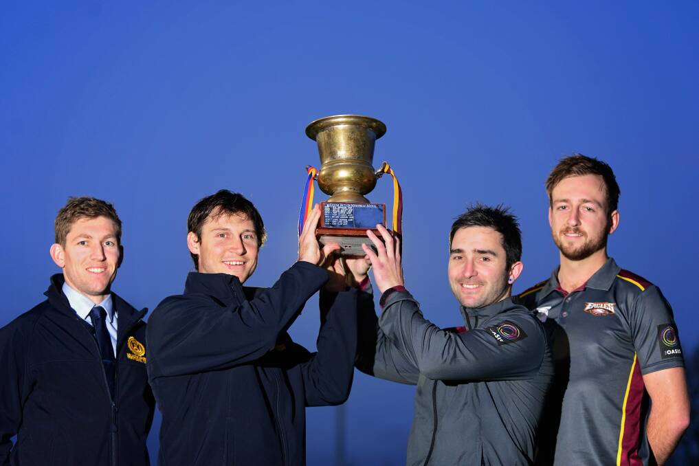 Old Scotch vice-captain Jake Terry and assistant coach Daniel Ellis with Uni Mowbray captains Anthony Viney and Damon Howe hold up the Butzin-Jordan Cup. Picture: Phillip Biggs.