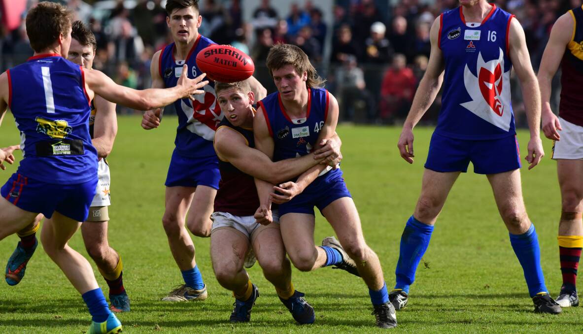 GOTCHA: Lilydale's Logan Reynolds is wrapped up by Old Scotch co-coach Jake Terry in the 2016 grand final at Windsor Park. Picture: Paul Scambler