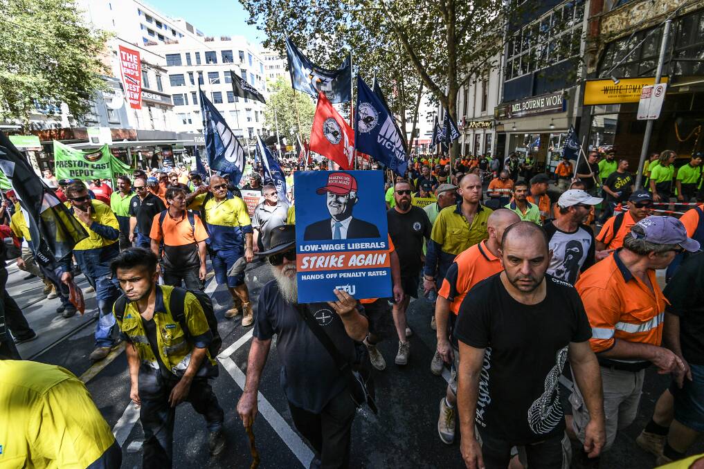 Unions rally in central Melbourne to protest the federal government's building code and penalty rate decision. Picture: Justin McManus