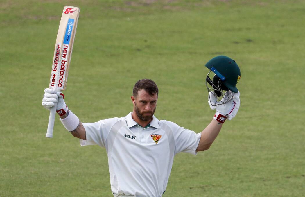 WELL DONE: Matthew Wade of the Tigers celebrates a century. Picture AAP
