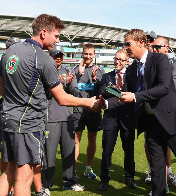 FLASHBACK: Shane Warne presents Launceston-born James Faulkner with his Baggy Green Cap before the fifth Ashes Test at The Oval in 2013. Picture: Getty Images