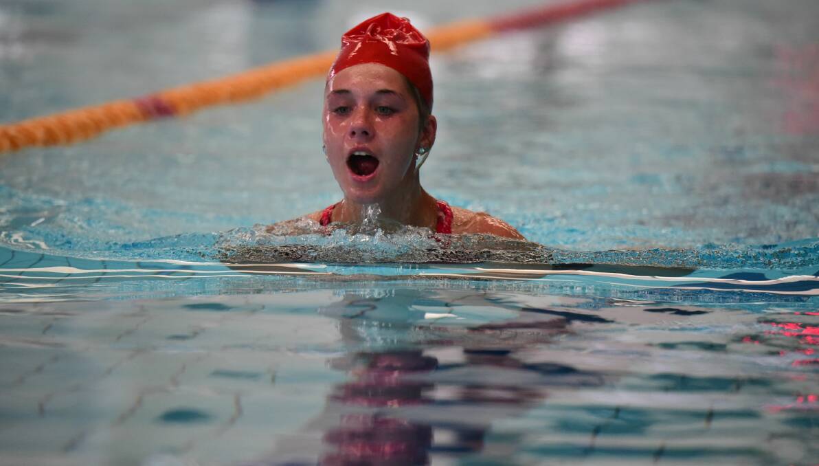 Grade 8 student Chloe Wadley takes to the pool for a breaststroke event. 