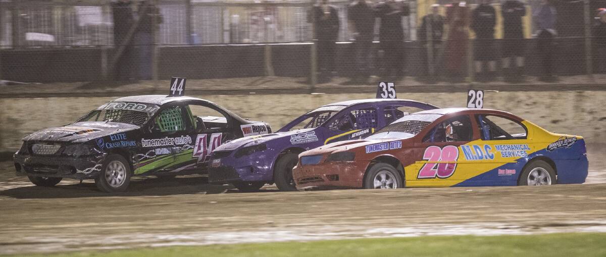 TIGHT: Street Stocks racing three wide with John Riley on the outside, Matt Atkinson in the middle and Dale Riley Jr on the inside. Picture: Angryman Photography