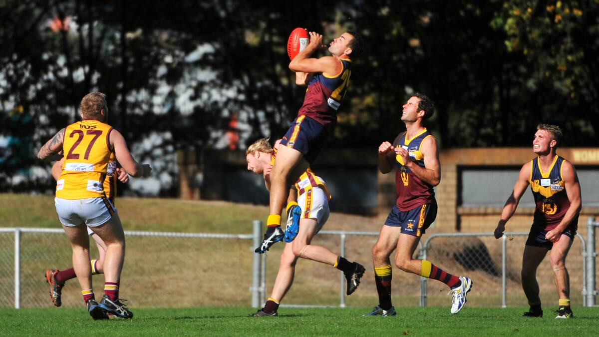 BIG LEAP: Old Scotch's Ryan Worn marks high over a Uni-Mowbray opponent in Round 4. Picture: Scott Gelston.