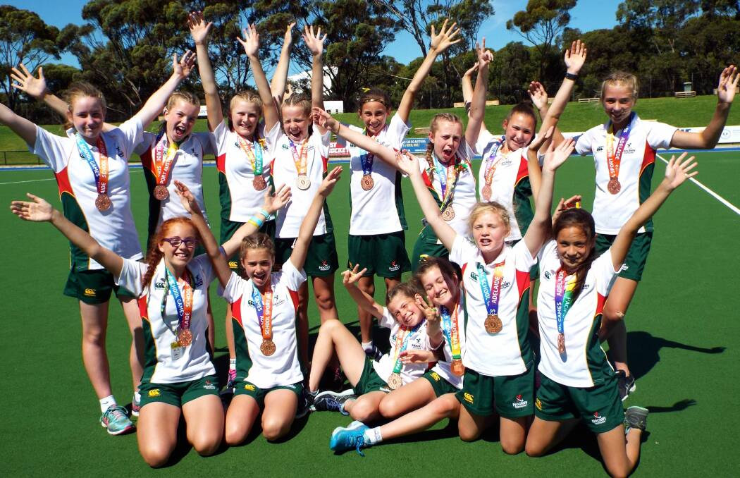GREAT EFFORT: State under-12 Pacific Schools Games bronze-medal winning team, including Northern Tasmanians Isabella Davie and Ashley Demarco, celebrate in Adelaide. Picture: Supplied
