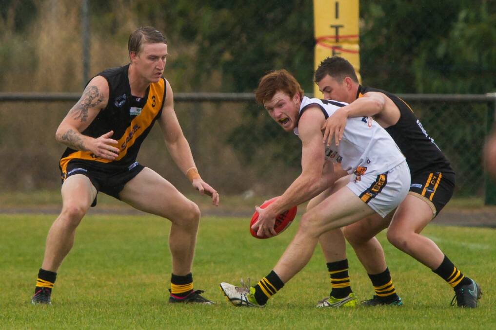 GOING NOWHERE: Rocherlea's Jordan Cousens and Jacob Hawkins close in on Longford utility Jackson Blair before Easter. Rocherlea remain undefeated, while Longford are yet to register a win. Picture: Phillip Biggs
