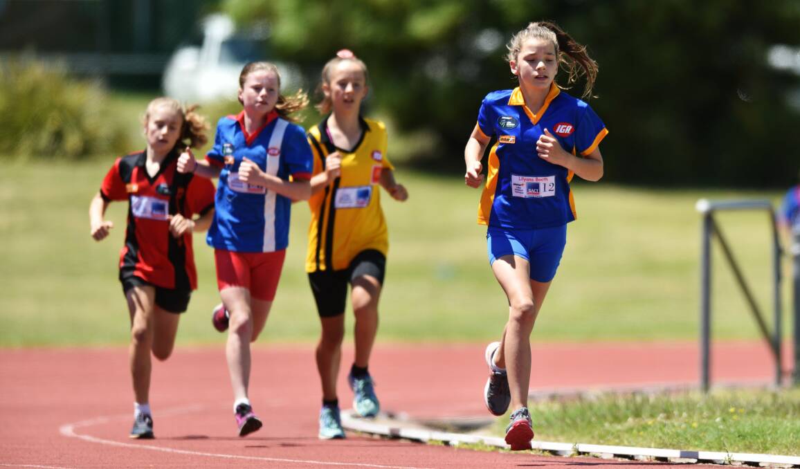 IN CONTROL: St Helens runner Lilyana Booth leads the girls under-12s 800-metre race at St Leonards Athletics track. Pictures: Scott Gelston