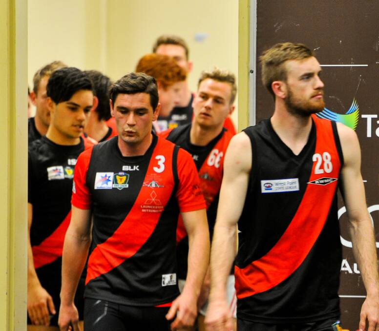 PENSIVE: North Launceston captain Taylor Whitford leaves the team meeting led by in-form midfielder Josh Pointing on Thursday evening. Picture: Scott Gelston