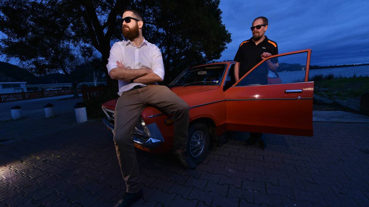 Karl Singline and Kelvin Todd hit the streets in Singline-family heirloom, a 1978 Datsun 120Y, to prepare for the Shitbox Rally. Picture: Scott Gelston