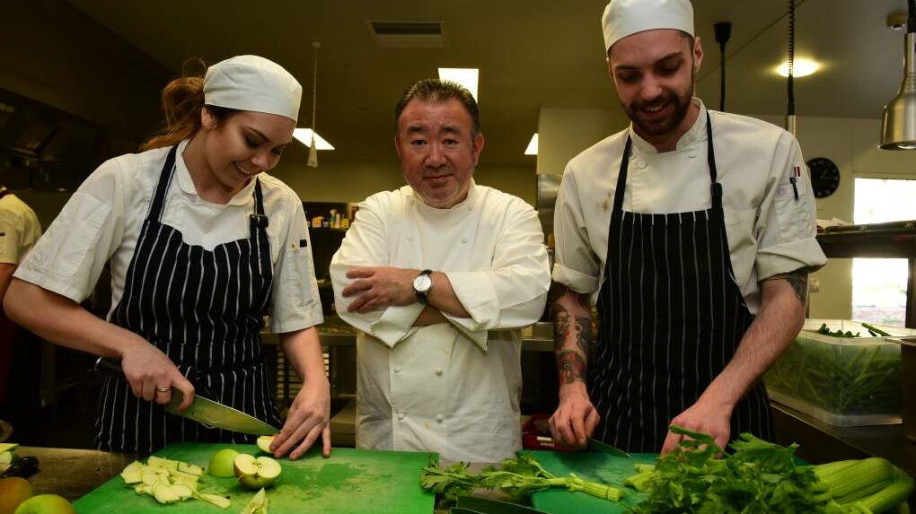 Aimee Woods, a final year apprentice at Lost Farm Barnbougle with chef Tetsuya Wakuda and Brad Cubit, a third year apprentice at Cafe Culture. Picture: PAUL SCAMBLER