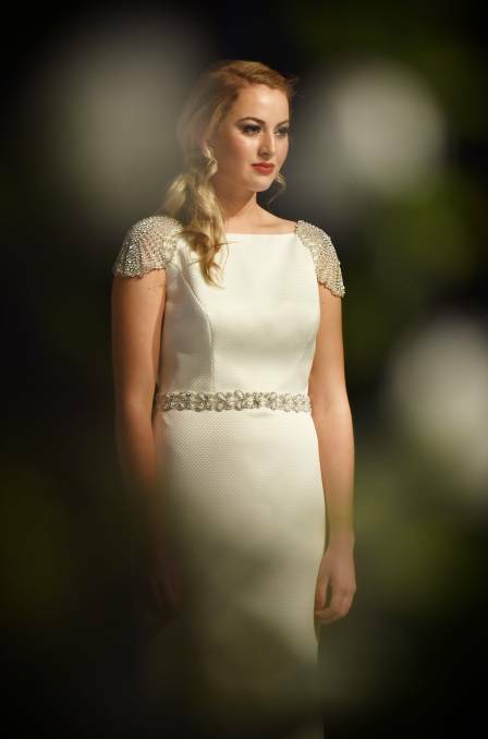 Karley Beer takes to the catwalk in a dress from Little White during the fashion parade at Weddings at The Albert Bridal Expo. Picture: Scott Gelston.