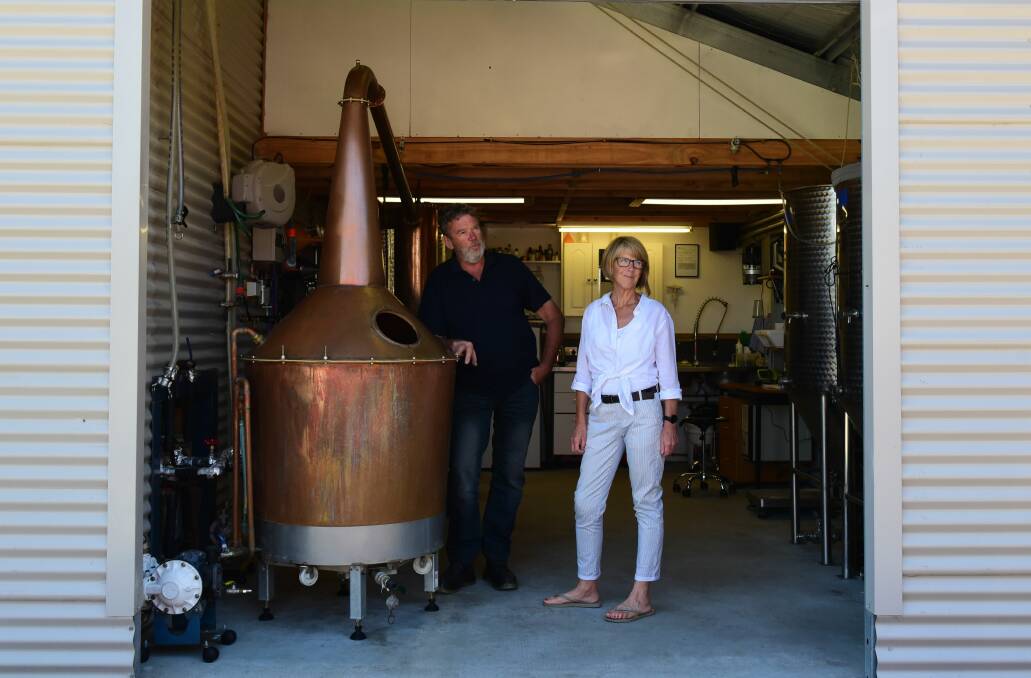 Mathew and Julie Cooper at home in their boutique distillery. Picture: Paul Scambler