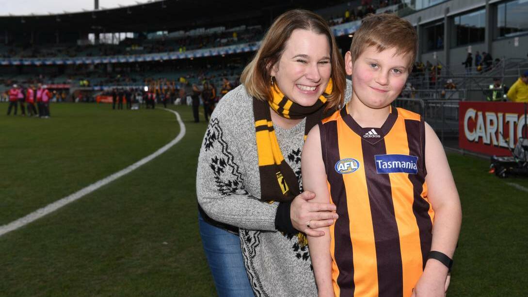 MATCH DAY: Nicholas Geeves, 9, of Hobart with his mother Tracy Geeves. Nicholas took to the field with Hawthorn. Pictures: Scott Gelston