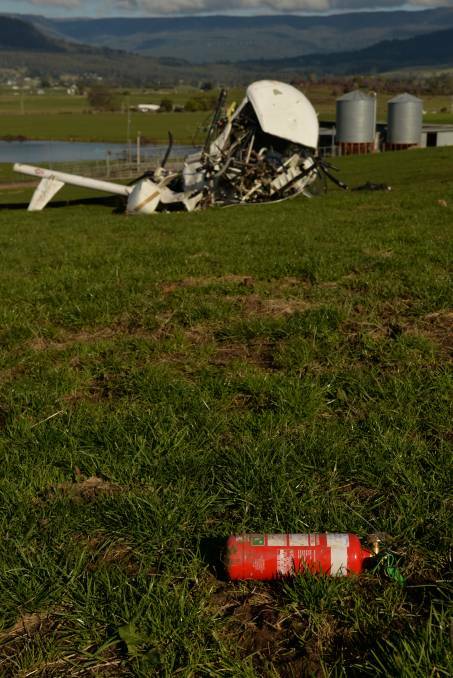 A helicopter was completely destroyed when it crashed while crop spraying at Deloraine on Wednesday. Picture: Brodie Weeding
