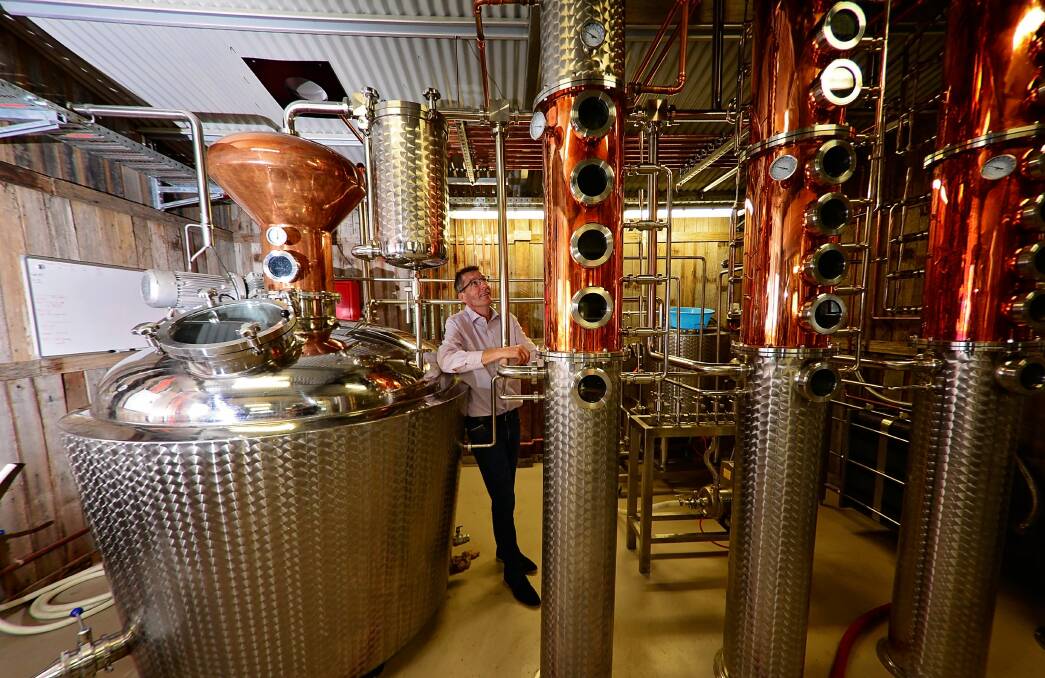 AT WORK: Corra Linn Distillery's John Wielstra gets up close and personal with his still. Picture: Phillip Biggs