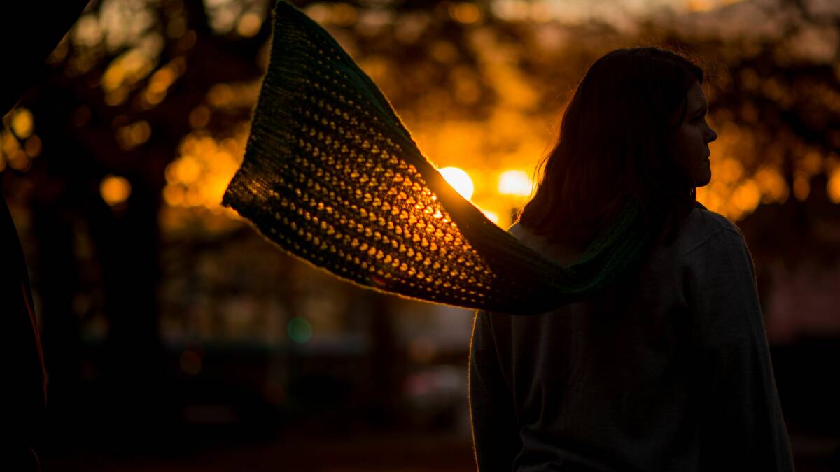 A wind gust catches a scarf at sunset in Launceston's City Park. Picture: Scott Gelston