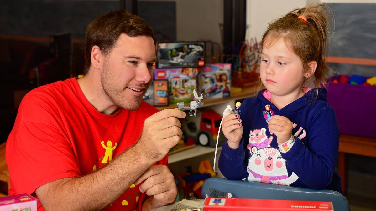 CLICK TO READ MORE: Ava Harwood, 6, plays Lego with Tasmanian Brick Enthusiasts Club member James Atkinson. The club donated more than 35 sets of lego to the Launceston General Hospital's children's ward. Picture: Phillip Biggs